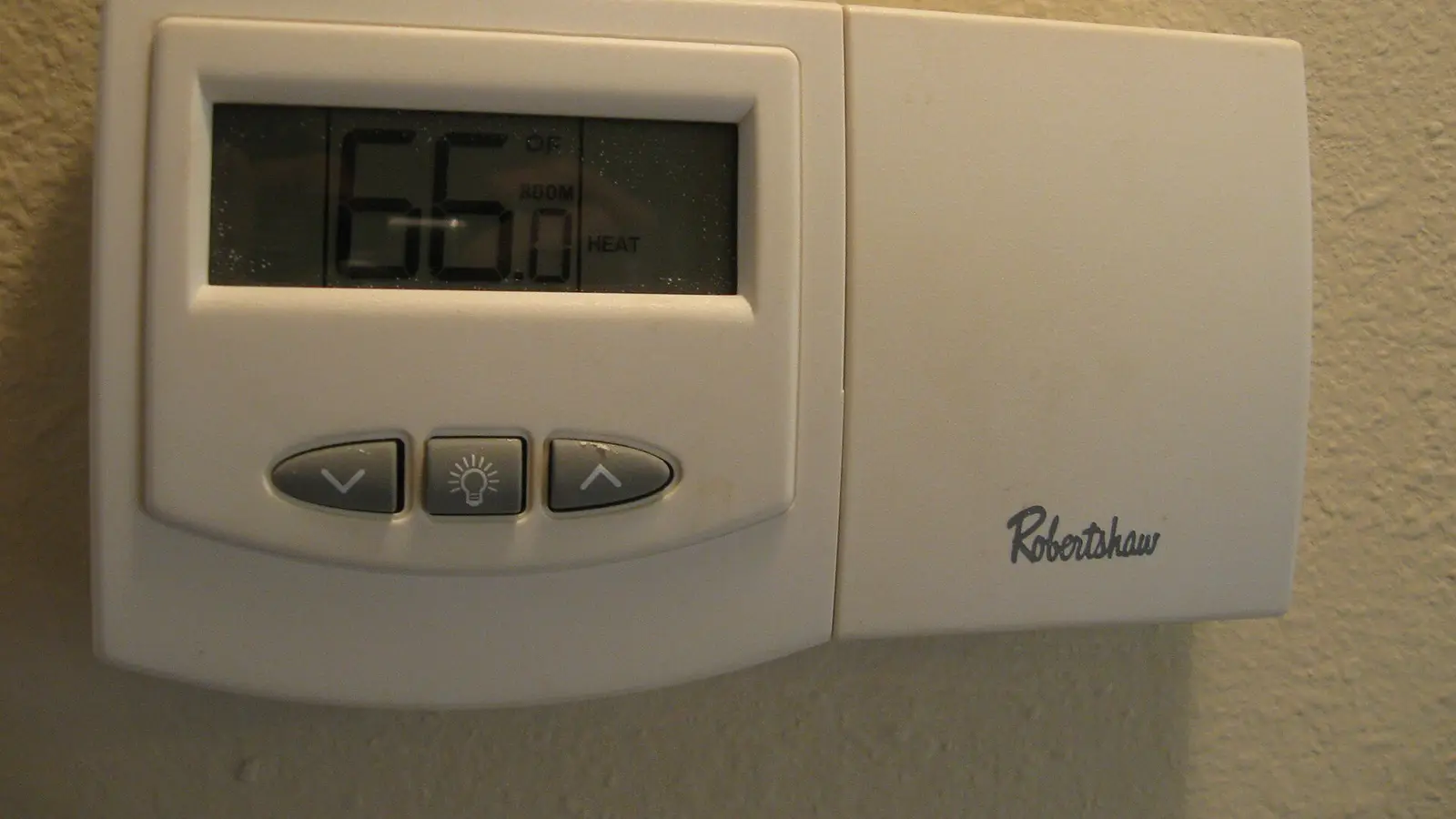 Digital thermostat controlling a home's central heating and cooling